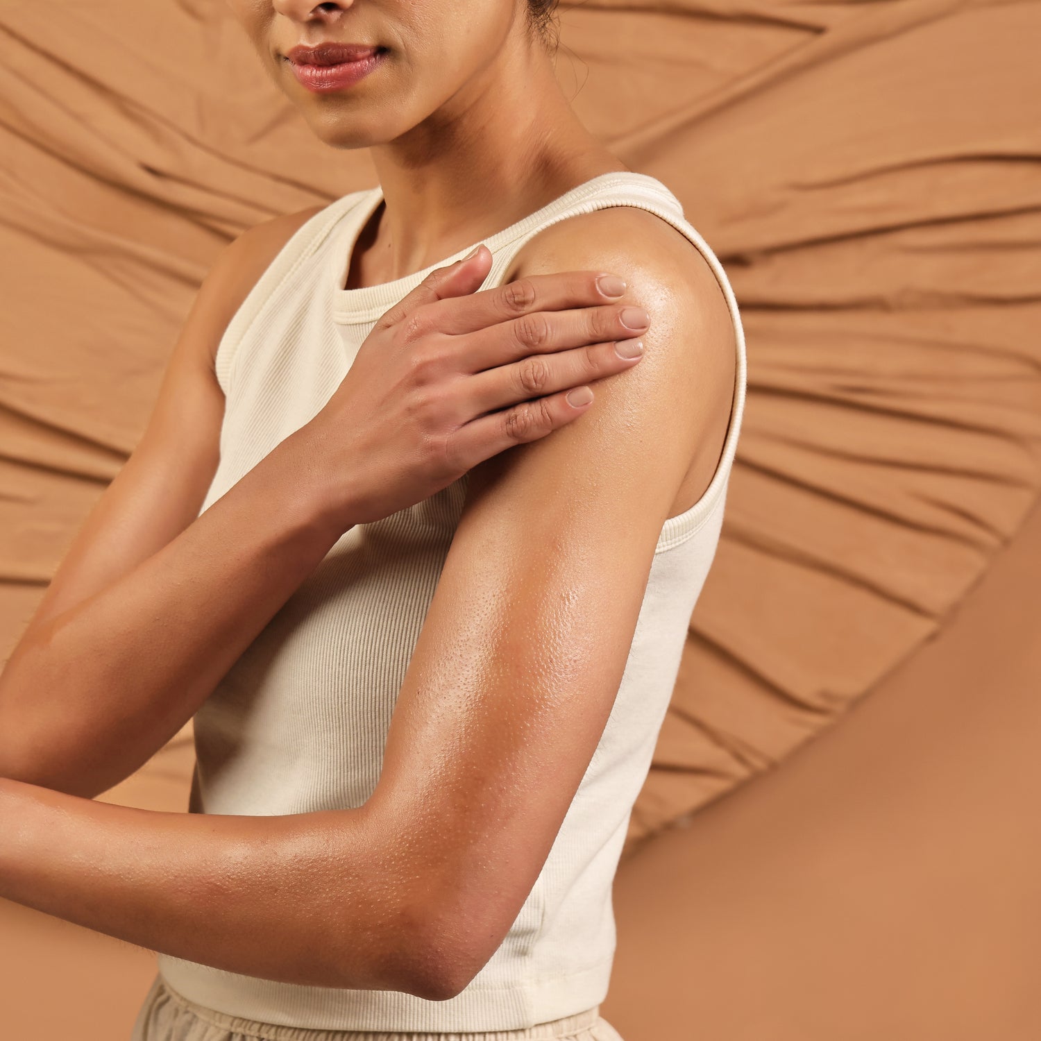 Art of Vedas Ayurveda Abhyanga Ritual - Woman Applying Ayurvedic Abhyanga Oil to Shoulder for Nourishing Self-Massage Ritual