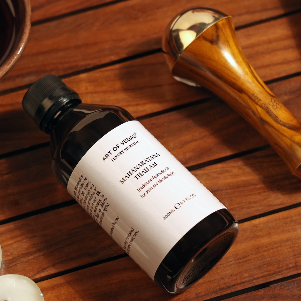 The image showcases Mahanarayana Thailam, a distinguished Ayurvedic herbal oil known for its efficacy in relieving joint and muscle pain. The product is displayed in a traditional, appealing bottle that conveys its authenticity and quality. The background